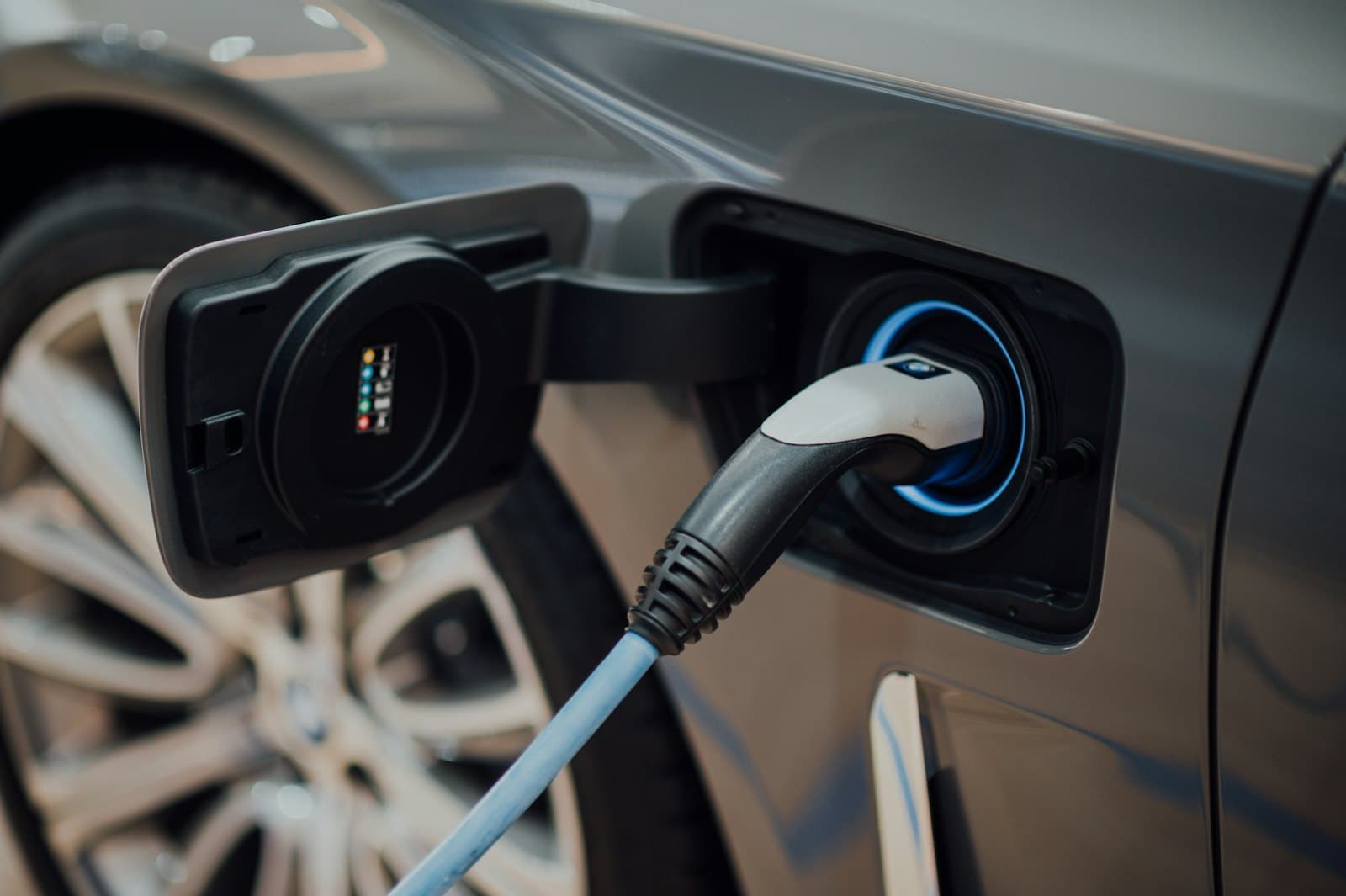 An electric car plugged in to charge