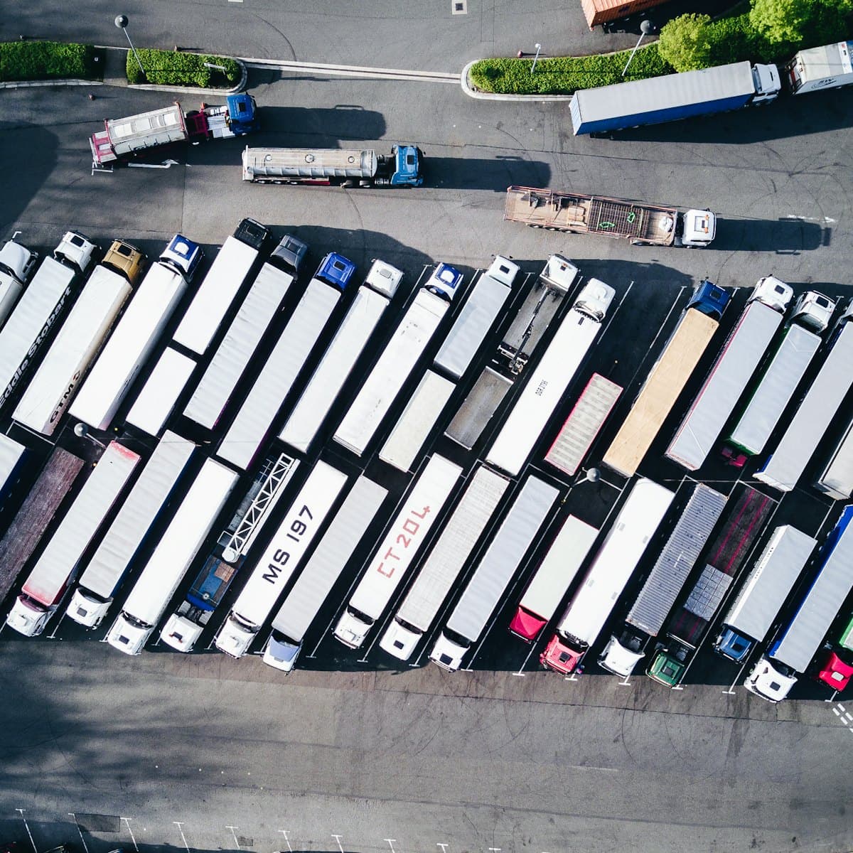 Aerial view of freight trucks parked in a depot