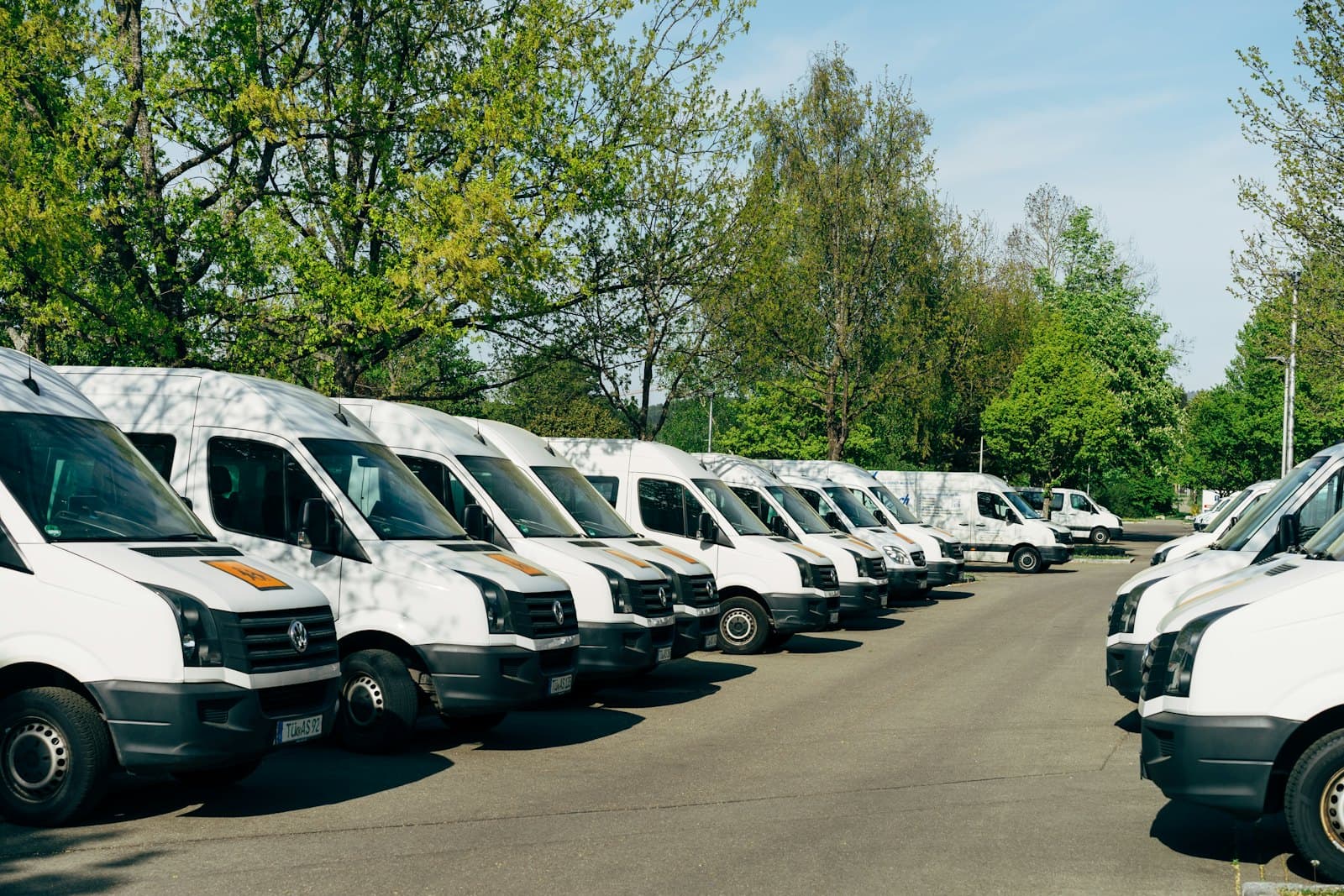 A row of white delivery vans